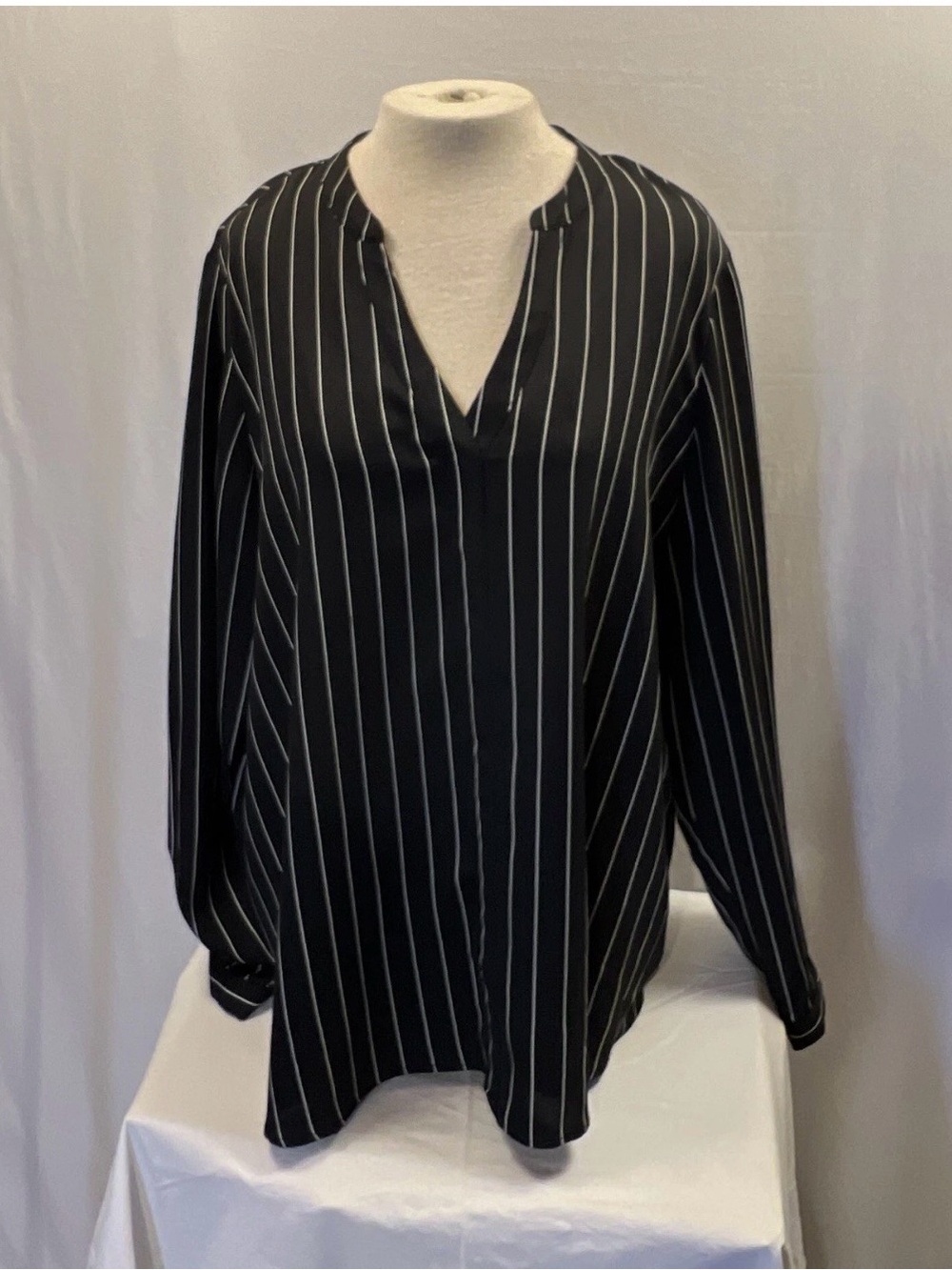 Jennifer Lopez Black Blouse with White Pinstripes